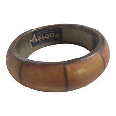 This vintage Aziono wide bangle bracelet is a gorgeous piece from India that will quickly become a go-to accessory for casual wear. The handcrafted, wide cuff bracelet which was found at an estate sale consists of bone (or faux horn) with brass accent and measures approximately 7.25″ wide. It will look beautiful on your wrist! Wide Cuff Bracelets, Wide Cuff, Brass Accents, Bangle Bracelet, Estate Sale, Cuff Bracelet, Horn, Bangle Bracelets, Casual Wear