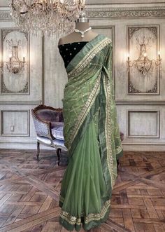 Beautiful dull green organza saree with broad laces and bottle green velvet blouse piece Lux Green Saree Contrast Blouse, Green Dola Silk Pre-draped Saree With Dupatta, Elegant Green Lehenga With Sheer Dupatta, Green Dola Silk Pre-draped Saree For Diwali, Elegant Green Organza Lehenga, Green Pre-draped Saree With Resham Embroidery For Diwali, Traditional Green Organza Blouse Piece, Green Organza Blouse Piece With Zari Work, Elegant Organza Blouse Piece In Pista Green