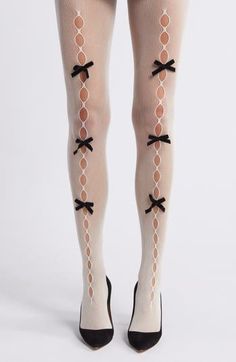 Delicate velvet bows detail the alluring oval openings on flirty fishnet tights designed with a high waist. Elastic waist Nylon Hand wash, dry flat Imported Coquette Tights, Tights With Holes, Lace Socks Outfit, Tights With Bows, Lace Tights Outfit, Skeleton Tights, Twee Fashion, Clue Costume, Bow Tights