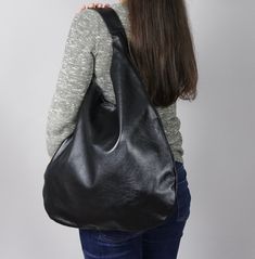 Oversized bag - hobo bag black Dimensions: Height from top of handle to base: 66cm (26 inch) Width at widest point: 49cm (19.2 inch) Large hobo bag made from high quality leather. This leather handbag can be worn on your shoulder, on the forearm or in your hand. This leather bag is a perfect everyday bag! There is a lot of space and you can put there everything in your everyday life. * Top closure magnet for security * Includes internal pockets for mobile phone and other small items Shipping: * Versatile Black Hobo Bucket Bag, Black Canvas Hobo Bag For Daily Use, Versatile Black Hobo Bag, Versatile Black Hobo Bag For Everyday, Black Leather Hobo Bag For Daily Use, Soft Leather Hobo Bag For Errands, Black Hobo Bucket Bag For Daily Use, Black Hobo Bag With Removable Pouch, Black Hobo Bag With Removable Pouch For Everyday