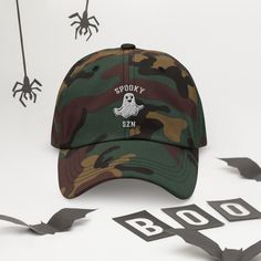 The only hat you need this fall for Halloween/Spooky SZN! Rock this adorable ghost cap with our matching Spoozy SZN sweatshirt: https://quebonito.shop/products/spooky-szn-unisex-sweatshirt • 100% chino cotton twill • Green Camo color is 35% chino cotton twill, 65% polyester • Unstructured, 6-panel, low-profile • 6 embroidered eyelets • 3 ⅛” (7.6 cm) crown • Adjustable strap with antique buckle • Blank product sourced from Vietnam or Bangladesh This product is made especially for you as soon as y Spooky Szn, Camo Colors, Halloween Spooky, Shop Products, Green Camo, Dad Hat, Trucker Cap, Need This, Dad Hats