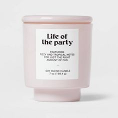 a pink candle with the words life of the party on it