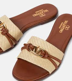 Find VALENTINO Vlogo Raffia-trimmed Leather Slides on Editorialist. Upper: fabric. Lining: leather. Sole: leather insole and sole. Toe shape: round open toe. Made in Italy. Includes: shoe box. Designer color name: Naturale/Tobacco.