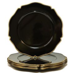 black and gold plates stacked on top of each other