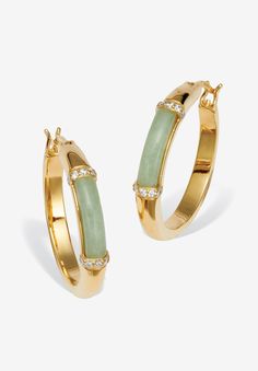 She'll love this feminine pair of genuine green jade hoop earrings. Each jade cabochon is set between rows of sparkling, round cubic zirconia stones. The perfect blend of natural beauty and elegance! 18k yellow gold-plated with .18 TCW CZ.FABRIC: 18k Gold-PlatedMain Stone: 2 Special Cabachon Cut Genuine Green Jade, 12 mm x 3 mm20 Round Brilliant Cut Cubic Zirconias, .18 carat total weight, 1.25 mm x 1.25 mmDimensions: 4 mm wide x 24.5 mm long x 2.5 mm highIncludes gift box and drawstring pouch | Elegant Jade Hoop Earrings, Gold Jade Hoop Jewelry, Green Jade Hoop Jewelry, Jade And Gold Jewelry, Green Jade Hoop Earrings, Luxury Green Hoop Jewelry, Cabochon Jewelry, Earrings Green, Jade Jewelry