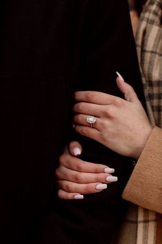 a close up of a person wearing a ring