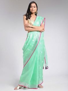 An embroidered linen saree with an all-over embroidered butti and zari details. Comes with a contrast blouse piece. Linen fabric Dry clean only Handcrafted in India Saree length - 5.5 meters Blouse: Length - 1 meter Model height 5 feet 7 inches Instructions: Dry clean only This product will be shipped within 20-25 days of the order placed Pink Linen Saree, Neem Tree, Trendy Suits, Linen Sarees, Linen Saree, Contrast Blouse, Anarkali Dress, Pink Linen, Indian Ethnic Wear