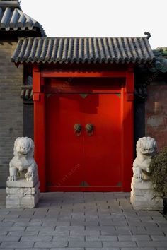 a red door with two lions in front of it