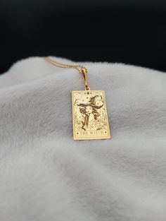 Introducing our Witch Tarot Card Necklace, a delicate and enchanting piece crafted in 14K gold. This dainty spiritual charm necklace features a beautifully detailed tarot card design, perfect for those who appreciate the mystical and magical. Handmade with care, this tiny tarot necklace makes a thoughtful and unique birthday gift, offering a touch of elegance and spiritual symbolism.  ⚜️ Package included: One Handmade Necklace ⚜️ Pendant Sizes: 14 / 16 / 18 / 20 / 22 / 24 / 26 / 28 / 30 mm ⚜️ Ne Mystical 14k Gold Jewelry Gift, Mystical 14k Gold Jewelry, Mystical Yellow Gold Jewelry For Gift, Mystical Engraved Gold Jewelry, Mystical Gold Jewelry For Anniversary, Gold Mystical Jewelry For Anniversary, Mystical Gold Charm Necklace Gift, Mystical Gold Engraved Necklace, Mystical Engraved Gold Necklace