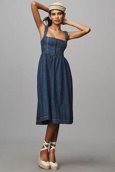 Denim, decoded: We’re digging denim in every corner of our closet. A different sort of Tagliatelle. Crafted from denim, the Tagliatelle Midi Dress by Reformation presents a fitted, corset-style bodice and full, swinging skirt. | Tagliatelle Denim Midi Dress by Reformation in Blue, Women's, Size: 12, Cotton at Anthropologie Denim Whale, Dress For Date Night, Dress For Date, The Swap, The Reformation, Full Midi Skirt, Denim Midi Dress, Midi Wrap Dress, Reformation Dress