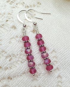 Beautiful deep pink czech glass earrings are sure to look fabulous with any outfit, dress them up or wear with your favorite jeans! A lovely gift, sentiment, even stocking stuffer! Made with faceted czech glass beads and silver accents. Earrings measure 1.25 inches Czech Glass Crystal Dangle Earrings, Czech Glass Crystal Earrings With Ear Wire, Pink Hypoallergenic Dangle Crystal Earrings, Adjustable Czech Glass Crystal Earrings, Elegant Pink Czech Glass Earrings, Silver Crystal Earrings With Czech Glass, Pink Sterling Silver Drop Crystal Earrings, Pink Czech Glass Jewelry For Party, Pink Czech Glass Party Jewelry