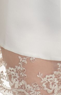 A lustrous satin robe edged with sheer floral lace is sure to make your mornings and evenings a little bit sweeter. 35 1/2" length (size Medium) Shawl collar Three-quarter sleeves Removable tie belt 100% polyester Hand wash, dry flat Imported Delicate Lace For Wedding Night, Silk Wedding Dress With Contrast Lace, Spring Party Lace With Contrast Detail, Feminine Summer Contrast Lace, Feminine Dresses With Satin Trim, Elegant Formal Lace With Bodice Detail, Elegant Formal Lace With Lace Bodice, Elegant Formal Lace With Lace Patchwork, Feminine Summer Lace With Contrast Details