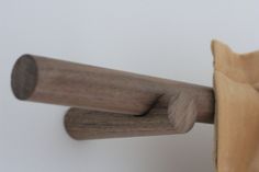 a close up of a wooden handle on a curtain