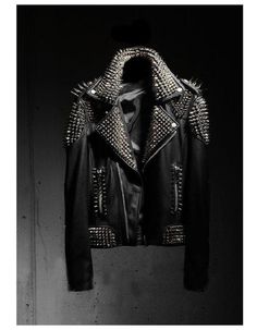 Punk Style Outerwear With Rivets For Fall, Edgy Studded Biker Jacket For Winter, Rock Style Studded Leather Jacket For Winter, Winter Rock Style Leather Jacket With Studs, Edgy Studded Leather Jacket For Biker Events, Edgy Studded Leather Jacket For Biker, Fall Rock Style Leather Jacket With Spikes, Edgy Black Leather Jacket With Spikes, Rocker Biker Jacket With Rhinestone Rivets