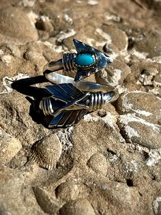 Introducing our bold and unique Arrow Ring! Available in sizes 5-12, including half sizes. Expertly crafted with the perfect blue turquoise stone, this ring is sure to make a statement. Leave your desired size in the comments for a perfect fit. Bohemian Stackable Blue Turquoise Ring, Bohemian Turquoise Open Ring For Promise, Bohemian Blue Stackable Turquoise Ring, Adjustable Bohemian Turquoise Promise Ring, Adjustable Turquoise Bohemian Crystal Ring, Bohemian Turquoise Open Promise Ring, Bohemian Open Turquoise Promise Ring, Unique Turquoise Stackable Jewelry, Unique Stackable Turquoise Jewelry