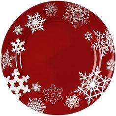 a red plate with white snowflakes on it