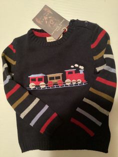 Rosie Whelan  “The Finest Quality” Sweater NEW WITH TAGS --  NEVER WORN  Embroidered Train - Metallic Thread Size 2T 🎉 Free Shipping 🎉 If interested, check out my other listings — TONS more to follow. ~<<<🩶👦🏼🔴🌑🚂🚂🚂🌑🔴👦🏽🩶>>>~  🏠 FROM MY SMOKE-FREE & PET-FREE HOME 🏠 Boys Stripes, Striped Sleeve, Baby & Toddler Clothing, Metallic Thread, We Wear, Fall Fashion, Red Gold, Autumn Winter Fashion, Sweater Outfits