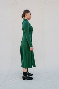 [meet me by our favorite fountain after two]Strut your stuff! The Ada in forest green is a long-sleeved, mock neck dress that is figure-hugging at the top and relaxed fitting from the waist down; with inviting two-way slits. This dress gives you a comfortable fit in all the right places, highlighting exposed seams with a stretch that is oh so cozy! •Mockneck collar•Super flattering fit•Slits in front and back•Exposed seams•Super cozy stretchAmari is 5'9", dress size 10, wearing a size L. Elle is Dark Green Fitted Long Sleeve Midi Dress, Fitted Long Sleeve Dark Green Midi Dress, Fitted Dark Green Long Sleeve Midi Dress, Green Fitted Midi Dress For Fall, Green Midi Dress For Workwear In Fall, Fitted Green Midi Dress For Fall, Green Midi Dress For Fall Workwear, Green High Neck Winter Dress, Green High Neck Dress For Fall