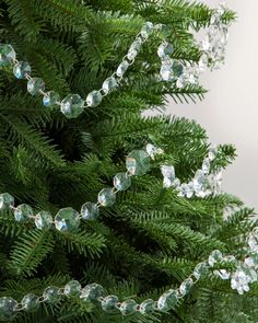 a close up of a christmas tree with clear beads