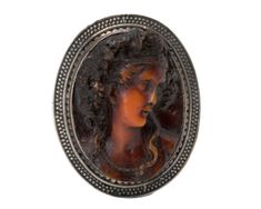 1920s era Carved Cameo Brooch This gorgeous brooch features an Art Nouveau style carved cameo framed by an Art Deco style Sterling Silver frame. It measures a generous 53 x 43 mm and is 18 mm deep. It fastens securely with a safety clasp. It adds a beautiful touch to any look! Feminine, delicate and makes a statement! This piece shows that high quality craftsmanship will withstand the test of time! This is a true vintage piece, and we are honored to offer it to our Etsy family. **Please follow o Antique Carved Brooches For Formal Occasions, Antique Cameo Medallion Brooch, Antique Cameo Medallion Brooches, Antique Cameo Brooch Collectible, Antique Cameo Brooches Collectible, Ornate Carved Collectible Brooches, Antique Cabochon Medallion Brooches, Antique Medallion Cabochon Brooches, Cameo Brooch