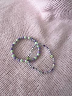 Beaded green and purple bracelet duo Handmade Green Beaded Bracelets, Cute Bracelet, Purple Bracelet, Purple And Green, Cute Bracelets, Beaded Jewelry Diy, Green Bead, Jewelry Diy, Diy Bracelets