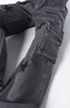 Step back into the Y2K era with gray cargo pants, adorned with a star print. High-waisted, wide-leg style captures the classic jean aesthetic. Crafted from a durable cotton-denim blend for ultimate comfort. Seven-pocket detailing with zip-button fastening for a touch of utilitarian chic. Y2K aesthetic Star printed 4 front, 3 back pockets Cotton, denim Jean pants Zip & button fastening High waist Wide leg Belt not included Streetwear Wide Leg Bottoms With Star Print, Star Print Wide Leg Bottoms For Streetwear, Wide Leg Bottoms With Star Print For Streetwear, Wide Leg Star Print Bottoms For Streetwear, Black Wide Leg Pants With Star Print, Straight Leg Pants With Star Print For Streetwear, Straight Leg Star Print Pants For Streetwear, Black Straight Leg Pants With Star Print, Straight Leg Star Print Bottoms For Streetwear