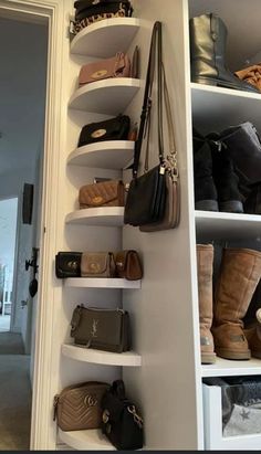 a white shelf filled with lots of purses and handbags on top of it