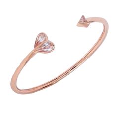 Handcrafted Of Rose Gold-Tone Metal, This Rock Solid Flex Cuff Is Embellished At The Ends With Two Of Kate Spade Signatures: A Heart And The Tip Of The Spade. They Punctuated It With Sparkling Faceted Crystals For The Finishing Touch. Rose Gold Metal, Crystal Glass Slides On Spade-B2 Weight: 4g Inner Circumference: 2.2" X 1.9" Handcrafted Smoke-Free As Well As Pet-Free Home Retail: $119 Adjustable Rose Gold Heart Bangle Bracelet, Kate Spade Party Bangle, Kate Spade Party Bangle Jewelry, Kate Spade Bangle For Party, Kate Spade Bangle Bracelets For Party, Adjustable Pink Kate Spade Bracelet, Adjustable Pink Kate Spade Bracelets, Adjustable Pink Kate Spade Jewelry, Kate Spade Rose Gold Bracelets For Gift