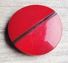 a close up of a red object on a table