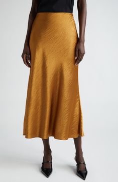 Hammered texture elevates the elegant look of this bias-cut satin skirt in a burnished golden hue that evokes autumnal splendor. 36 1/2" length (size 8) Hidden side-zip closure 100% polyester Dry clean Imported Designer Clothing Gold Satin Party Skirt, Elegant Gold Lined Skirt, Formal Silk Bias Cut Skirt, Elegant Gold Mini Skirt, Gold Long Skirt For Formal Occasions, Elegant Metallic Mini Skirt, Elegant Metallic Long Skirt, Elegant Formal Bias Cut Skirt, Chic Formal Metallic Skirt