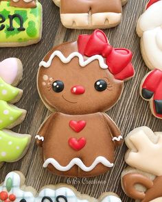 decorated cookies are arranged on a wooden table