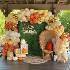 a little pumpkin birthday party with balloons and decorations