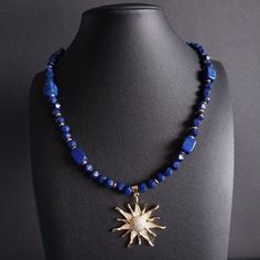 Exclusive lapis lazuli necklace with 18 carat gold-plated elements and sun pendant - 40 cm Discover the beauty and elegance of this handmade lapis lazuli necklace, perfect for special occasions or as a daily companion. This necklace impresses with the following features: High Quality Lapis Lazuli Stones: The deep blue color of the lapis lazuli stones gives this necklace a unique and luxurious look. Each stone is carefully selected and faceted to capture and reflect the light beautifully. Gold-pl Natural Stones Jewelry, Deep Blue Color, Sun Pendant, Lapis Lazuli Necklace, Stones Jewelry, Lapis Lazuli Stone, Natural Stone Jewelry, Summer Necklace, Stone Jewelry