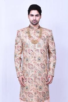 Peach longline sherwani with floral and geometric pattern multi colored embroidery. Comes with peach anarkali kurta and churidar.
Components: 3
Pattern: Embroidered
Type Of Work: Floral, Geometric
Neckline: Sherwani: Mandarin, Anarkali: Notched
Sleeve Type: Full
Fabric: Banglori Silk
Color: Peach
Other Details: 
Embellished sherwani buttons
Side pocketed pant
Note: Neckpiece worn by the model is not for sale
Occasion: Groom,Wedding - Aza Fashions Designer Sherwani With Zari Work For Navratri, Designer Zari Work Sherwani For Navratri, Navratri Designer Sherwani With Zari Work, Fitted Traditional Wear With Meenakari For Transitional Season, Designer Traditional Wear With Multicolor Embroidery For Festive Occasions, Bollywood Sherwani With Multicolor Embroidery And Zari Work, Designer Festive Traditional Wear With Multicolor Embroidery, Designer Multicolor Resham Embroidery Sherwani, Eid Sherwani With Multicolor Embroidery And Traditional Drape