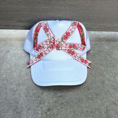 Super cute and unique one of a kind trucker hat with oversized flower ribbon bow. The perfect mix of sporty and feminine/boho vibes - its an easy accessory to add style to any wardrobe and would make a great gift for women! Each hat comes with my sun logo patch sewn on the back as shown in the last picture. Adjustable SnapBack closure Bucket Hat For Spring Gift, Spring Bucket Hat For Gift, Spring Bucket Hat As Gift, Spring Bucket Hat Gift, Vintage White Trucker Hat For Spring, White Snapback Mini Hats For Spring, Cute Festival Hats One Size Fits Most, Cute Adjustable Mini Hats For Festivals, Handmade Hats As Spring Gifts