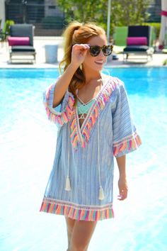 Rainbow Tassel Tunic :: NEW ARRIVALS :: The Blue Door Boutique Multicolor Fringe Beach Dress, Multicolor Fringe Dress For Beach, Multicolor Vacation Dress With Back Tassel Tie-up, Beach Cotton Dress With Tassels, Summer Cotton Dress With Tassels, Cotton Beach Dress With Tassel Ties, Bohemian Striped Vacation Dresses, Cotton Fringe Dress For Vacation, Bohemian Striped Dresses For Vacation