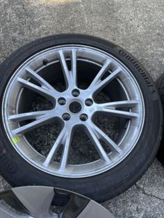 two tires sitting next to each other on the ground