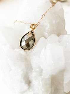 This necklace was worn on Law & Order's SVU "Return of the Prodigal Son", episode 9, season 22 and on Organized Crime "What happens in Puglia" episode 1, Season 1 on Kathleen Stabler, played by Allison Siko. The faceted pyrite semi-precious teardrop gemstone hangs from a dainty chain. It has a 1" + 1" extender and adjusts from 16" to 18" in length. Choose from sterling silver (.925) or Gold Filled. Your necklace comes tastefully packaged and ready for gift-giving in a beautiful box with microsue Gold Teardrop Charm Necklaces For Jewelry Making, Gold Teardrop Crystal Necklaces With Adjustable Chain, Gold Teardrop Crystal Necklace With Adjustable Chain, Spiritual Gold Teardrop Necklace, Gold Faceted Briolette Drop Necklace, Spiritual Gold Crystal Necklaces With Teardrop Pendant, Gold Spiritual Crystal Necklace With Teardrop Pendant, Gold Briolette Drop Necklace As Gift, Spiritual Gold Crystal Necklace With Teardrop Pendant