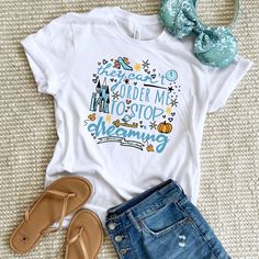 a t - shirt with the words under me to stop dreaming next to some shoes