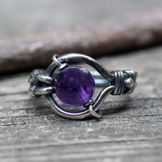 "Amethyst sterling silver ring An 8mm purple amethyst \"floats\" in a hand shaped sterling silver wire wrapped ring. ♥ The amethyst moves ♥" February Birthstone Ring, Jewelry Sale, Sterling Silver Wire Wrap, Wire Wrapped Rings, February Birthstone, Purple Stones, Boho Ring, February Birth Stone, Wrap Rings