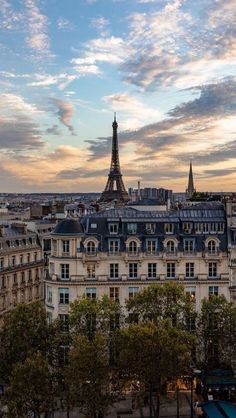 the eiffel tower towering over the city of paris, france at sunset or dawn