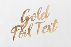 gold foil text on white paper that says gold foil text