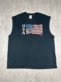 Show off your patriotic side with our 2003 American USA Flag Sonoma Jean Company Black Cut Off T-Shirt. This men's size XL tee features a bold American flag graphic and a stylish cut-off design, perfect for adding a touch of vintage Americana to your wardrobe. Please refer to the provided pictures for a detailed view of the condition and measurements of this item. We strive to present our pieces as accurately as possible, ensuring you have a clear understanding of their fit and wear. We put in our best efforts to clean and remove any stains, marks, etc. from our vintage pieces, but due to the nature of these items, some imperfections may remain. If you have any questions or require additional pictures, please don't hesitate to reach out to us! Americana Vintage, Vintage Americana, American Flag Shirt, Tee Shirt Homme, Flag Shirt, Vintage Pieces, Usa Flag, Cut Off, American Vintage