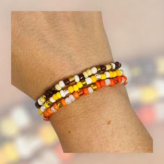 Add this stack bracelet to any combination to add a little Fall to your wardrobe. Choose from yellow, orange, or brown. Only available in Medium. Medium - The medium bracelet, 7.25", fits most adult women's wrists. NOTE: The best way to keep a stretch bracelet in good shape is to roll the bracelet on and off your hand and wrist. Continuously pulling it wider to put on your wrist will lead to overstretching and possibly breakage. Orange Stackable Bracelets With Round Beads, Stackable Orange Round Beaded Bracelets, Brown Friendship Bracelets With Tiny Round Beads, Adjustable Orange Stackable Beaded Bracelets, Brown Friendship Bracelet With Colorful Round Beads, Adjustable Stackable Orange Beaded Bracelets, Gift Stackable Brown Beaded Bracelets, Brown Stackable Beaded Bracelets Gift, Gift Brown Stackable Beaded Bracelets