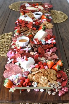 valentine's day charcuterie board with chocolate, marshmallows and strawberries