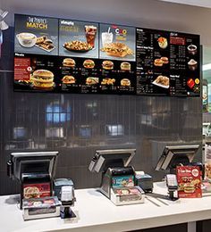 the menus are on display in front of the customers at the restaurant's counter