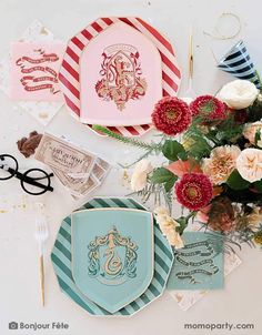 some plates and flowers on a table