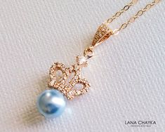 Wedding Light Blue Pearl Gold Crown Pendant Necklace with 14k Gold Filled Chain. CHAIN is 18 inches (45.7 cm) long, PENDANT is 1.18 inch (3cm) long including bail. BRIDAL NECKLACES SECTION: https://www.etsy.com/shop/LanaChayka?ref=seller-platform-mcnav§ion_id=11638944 BRIDAL JEWELRY SETS SECTION: https://www.etsy.com/shop/LanaChayka?ref=seller-platform-mcnav§ion_id=25839214 BRIDAL EARRINGS SECTION: https://www.etsy.com/shop/LanaChayka?ref=seller-platform-mcnav§ion_id=11638940 Elegant and timeles Elegant Light Blue Necklace For Wedding, Elegant Light Blue Wedding Necklaces, Royal Blue Jewelry For Wedding, Elegant Light Blue Jewelry For Wedding, Elegant Blue Wedding Necklaces, Elegant Blue Wedding Necklace, Blue Wedding Necklace, Pearl Gold Necklace, Crystal Wedding Necklace