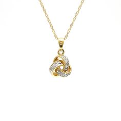 14 Karat Gold Love Knot Pendant Necklace Featuring 0.06 Carat Total Weight Round Diamonds of I1 Clarity and H/I Color. 16 Inches Long. Style KNOT. Available in white or yellow gold. Hallmarked Yellow Gold Diamond Pendant Necklace, 14k Gold Necklaces With Pave Setting For Anniversary, Gold Necklaces With Pave Setting In Sterling Silver, 14k Gold Pave Setting Necklaces For Anniversary, Yellow Gold Diamond Cut Pendant Necklace, 14k Gold Pave Setting Necklace For Anniversary, Yellow Gold Sterling Silver Necklace With Pave Setting, Anniversary Yellow Gold Necklace With Pave Setting, 14k Gold Pendant Necklace With Pave Setting