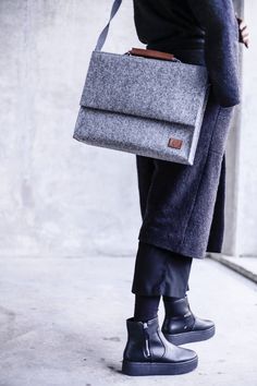 "a unisex briefcase that has an inside separate sleeve for laptop up to 15\". adjustable and removable shoulder straps included. SÖREN has a simple signature design for those who appreciate minimal style. unisex briefcase, edgy addition to a sharp office look, carry a laptop and essentials. the versatile case for laptop up to 15\" with a spare compartment inside the bag. front flap fastens with velcro straps, adjustable and removable shoulder straps included. ・upcycled material ・100% handmade in Macbook Pro Bag, Office Purse, Macbook Pro Laptop, Inch Bag, Ipad Bag, Unisex Backpack, Computer Bag, Minimal Style, Felt Bag